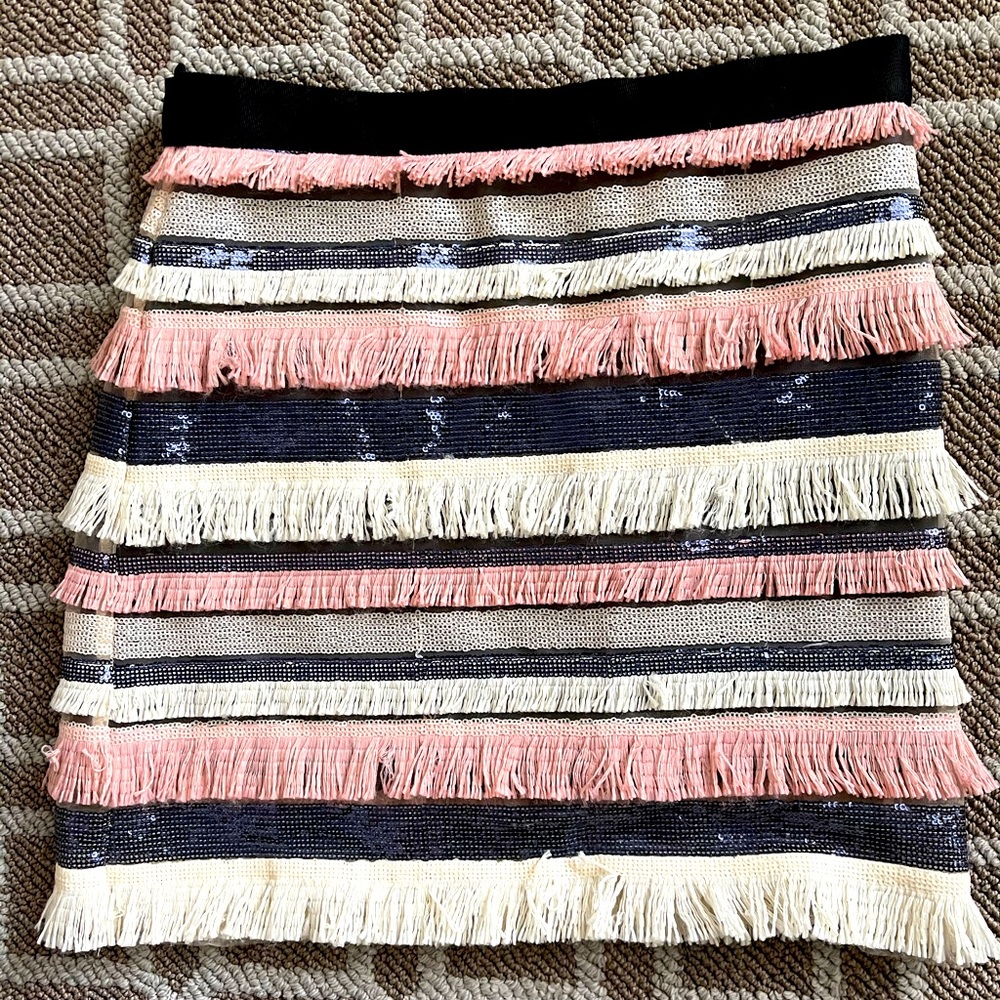 Sequence and fringe skirt.